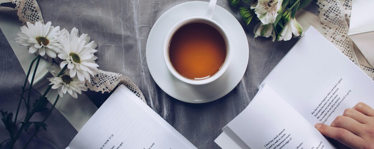 acupuncture for stress management - a cup of tea and books with flowers