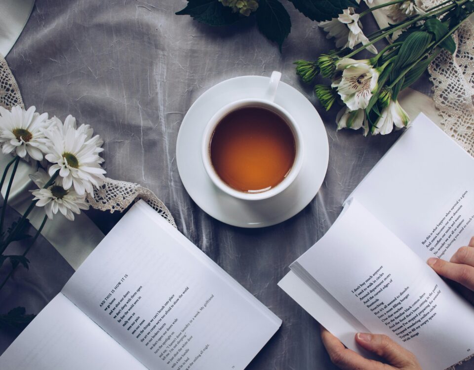 acupuncture for stress management - a cup of tea and books with flowers